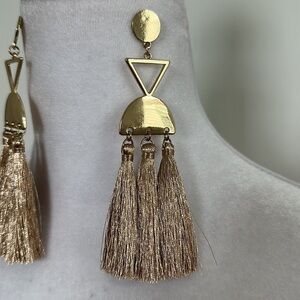 Gold tone chandelier pierced earrings.